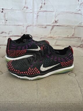 Nike Women’s Black Flyknit Athletic Shoes with Pink and Purple Stitching